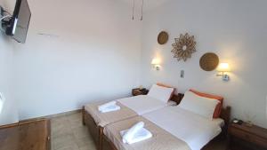 Ένα ή περισσότερα κρεβάτια σε δωμάτιο στο Hotel Beach Amaryllis