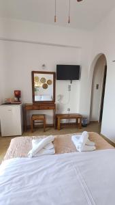 Ένα ή περισσότερα κρεβάτια σε δωμάτιο στο Hotel Beach Amaryllis