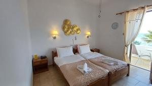Ένα ή περισσότερα κρεβάτια σε δωμάτιο στο Hotel Beach Amaryllis