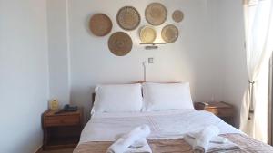 Ένα ή περισσότερα κρεβάτια σε δωμάτιο στο Hotel Beach Amaryllis