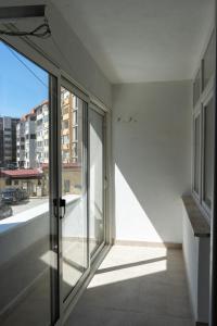 an empty room with a view of a building at Apartment in City Center of Skopje in Skopje