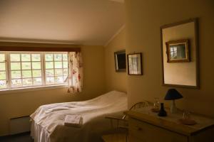 Katil atau katil-katil dalam bilik di Singerheimen