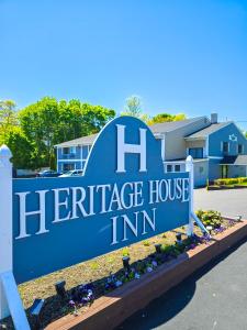 a sign for the hermitage house inn at Heritage House Inn in Hyannis