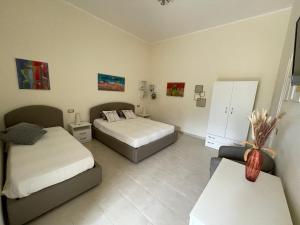 Postel nebo postele na pokoji v ubytování B&B Cafe' Fausu