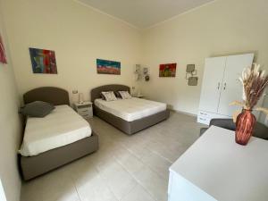 Postel nebo postele na pokoji v ubytování B&B Cafe' Fausu