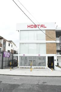 a hospital building with a hospital sign on it at HOSTAL VERONA in Quito