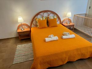 a bedroom with a bed with towels on it at Ocean View near the Beach Costa Adeje in Adeje +35 photos