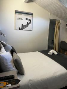 Кровать или кровати в номере Hotel Cote et Lac