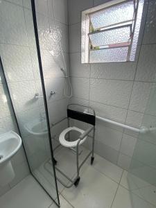 a bathroom with a shower and a toilet and a sink at RCM Vilas - Studio 103 Deluxe in Joinville +9 photos