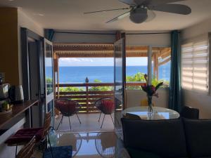 a living room with a view of the ocean at Coin paisible du nord in Acoua