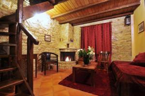 a bedroom with a fireplace and a bed in a room at Georgio's V Chalet Kalavrita in Kalavrita +162 photos