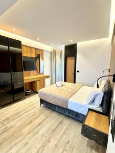 Postel nebo postele na pokoji v ubytování Hotel Joni