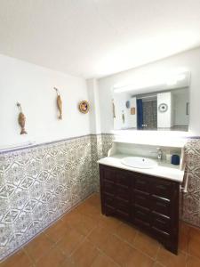 a bathroom with a sink and a mirror at Sea Views Benidorm Beach in Benidorm +12 photos