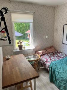 Postel nebo postele na pokoji v ubytování Stuga Sannerud Tived