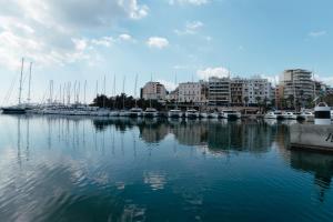 a view of a marina with boats in the water at Blue harbour house - style meets comfort in Piraeus
