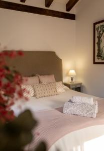 En eller flere senge i et værelse på La Esencia