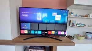 TV a/nebo společenská místnost v ubytování Nanà Holiday House
