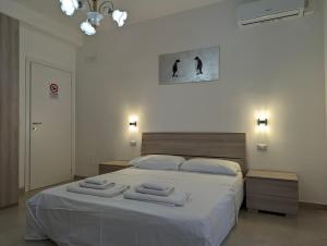 Ένα ή περισσότερα κρεβάτια σε δωμάτιο στο Fabiana's Rooms
