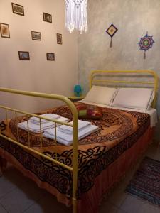 a bedroom with a bed in a room at Charme Rústico in Aljezur