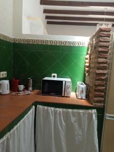 Kuchyňa alebo kuchynka v ubytovaní Casita en el centro con Wifi