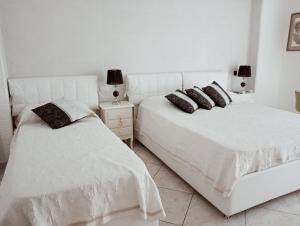 Säng eller sängar i ett rum på Stella Marina