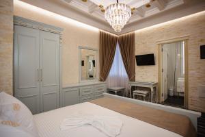 Postel nebo postele na pokoji v ubytování Ervini Boutique Hotel