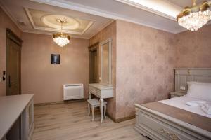 Postel nebo postele na pokoji v ubytování Ervini Boutique Hotel