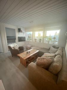 a living room with a couch and a coffee table at 1125 Fjällstugan in Lofsdalen