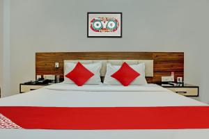 Voodi või voodid majutusasutuse OYO Flagship 81231 Hotel Seven toas