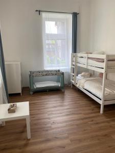 Postel nebo postele na pokoji v ubytování Horský apartmán Desná - Jizerky