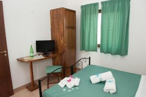 Postel nebo postele na pokoji v ubytování Oasi del Fauno