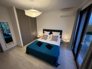 Posteľ alebo postele v izbe v ubytovaní Cala Rossa, Pinarello, Saint Cyprien - La Villa D'Alice