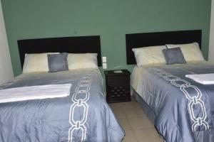 Кровать или кровати в номере Hotel Bacaanda