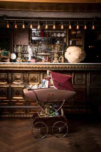 a bar with a wheelbarrow in front of a counter at Hotel B Berdichevsky in Tel Aviv