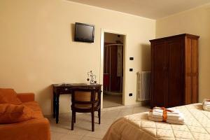 Postel nebo postele na pokoji v ubytování Agriturismo Il Barone