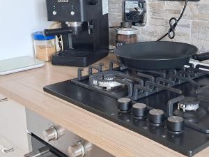 a frying pan on a stove in a kitchen at Casa Balda in Imperia