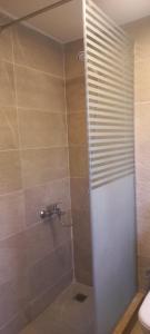 a bathroom with a shower with a sink and a toilet at Villa amoun in Sidi Krir 
