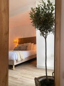 En eller flere senge i et værelse på El refugio del mar