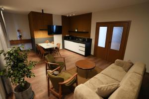 a living room with a couch and a table at Castlefront Villa in Gjirokastër