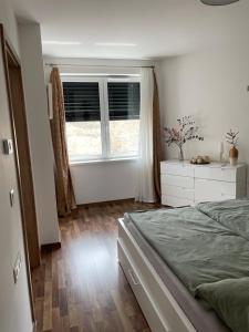 A bed or beds in a room at ERKEL 18 APARTMAN
