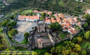 an aerial view of an old castle in a village at Casa das Flores in Bragança