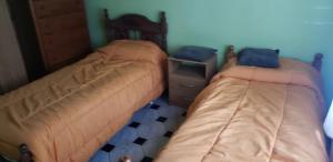 里奥格兰德Cierre definitivo la pagina no me deja cerrarlo no reservas的卧室里有两张并排的床