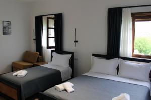 Postel nebo postele na pokoji v ubytování Guest House AmaDes