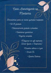 a invitation to a wedding with roses on a blue background at Casa Aconchegante na Montanha in Campos do Jordão