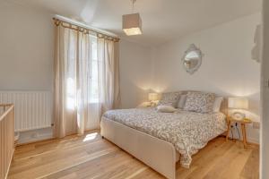 En eller flere senge i et værelse på Le Mousseau - proche du Zoo - tranquillité absolue