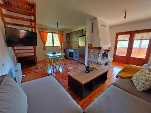 a living room with a couch and a table at Vikendica River Uvac in Rudo