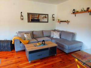 a living room with a couch and a table at Vikendica River Uvac in Rudo