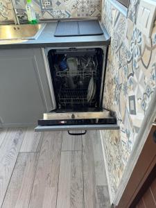 an oven with its door open in a kitchen at Atico Valentina in El Paso