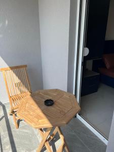 a wooden chair with a bowl on top of it at Vip apartmani in Tivat