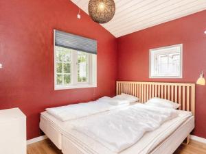 מיטה או מיטות בחדר ב-Holiday home Stege V